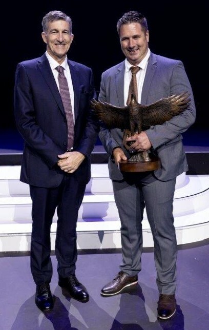 Hino Tshwane Dealer Principal Brandon Wegner (right) holding the Hino Dealer of the Year trophy as he stands alongside Andrew Kirby, President, and CEO of Toyota SA Motors, at the recent awards evening