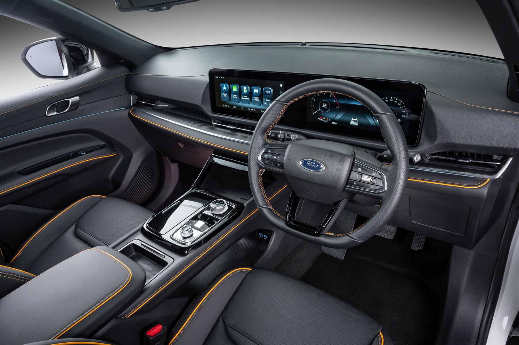 Stepping into the cabin, the Territory Dark Edition’s charcoal black headliner and pillars are set against black leather perforated seats, door trims and instrument panel inserts with Cyber Orange stitching. Stepping into the cabin, the Territory Dark Edition’s charcoal black headliner and pillars are set against black leather perforated seats, door trims and instrument panel inserts with Cyber Orange stitching.