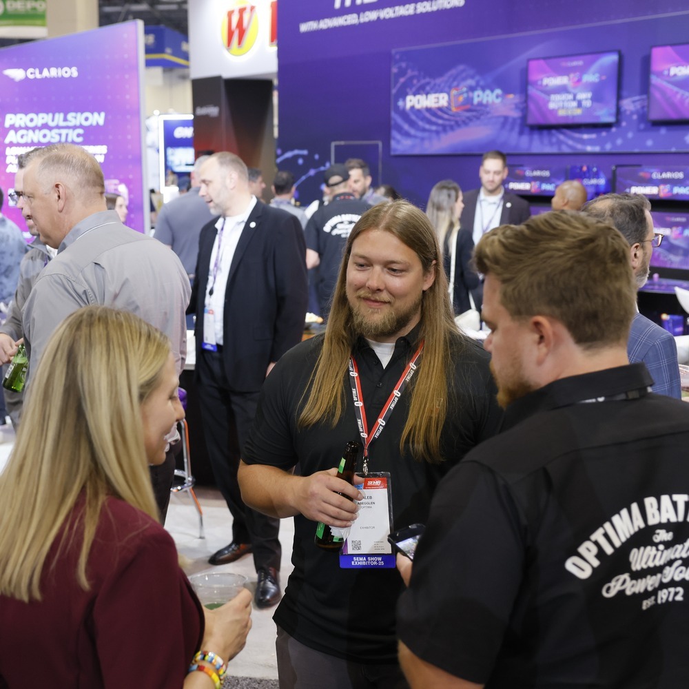 Visitors exploring exhibitor booths at AAPEX