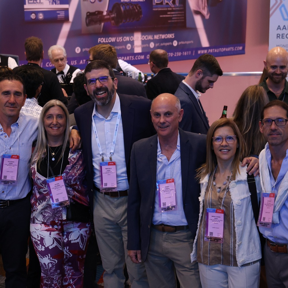 Industry professionals networking at an AAPEX opening reception