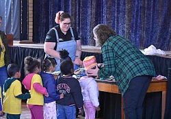 Wheel Well distributes hundreds of Halo Beanies to help improve child pedestrian safety